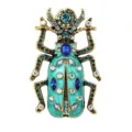 Detailed close-up of vintage gold alloy beetle brooch with green enamel and sparkling rhinestones. - XZ4548D Style / Mint Green
