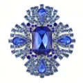 Detailed view of luxury royal blue crystal rhinestone brooch, sparkling vintage floral pin. - Silver Base (XZ4007A) / Sapphire Blue