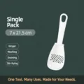 White plastic multi-functional kitchen spoon strainer for mashing and filtering food items. - White