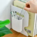 White plastic desktop bookend with integrated pen holder desk book storage stand. - Pen Holder
