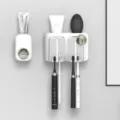 Wall-mounted toothbrush holder set, white and gold bathroom organizer with automatic dispenser. - Two-Grid White with Toothpaste Squeezer