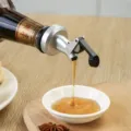 Japanese glass oil dispenser bottle with automatic flip lid for kitchen cooking and seasoning use. - Oil Bottle Spout Stopper