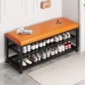 Panca scarpiera moderna in metallo con cuscino in pelle e doppio ripiano per l'ingresso. - Panca Portascarpe a Doppio Ripiano / 100x32x48cm / Cuscino Arancione / Telaio in Ferro Nero