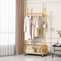 Gold standing clothes rack with wheels and bottom storage basket for bedroom and living room use. - 80cm Length / Gold