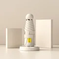 Parapluie pliant capsule mini compact en blanc crème élégant avec protection UV UPF50+. - Couleur Sable Chaud