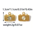 Gold metal camera pendant charm featuring sparkling rhinestone lens for DIY jewelry making. - TP2899-02 (Gold Camera Variant)