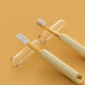 Dual-head pet toothbrush with transparent protective cases for comprehensive oral care. - Yellow