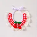 Close-up details of the cute red plaid pet bib with delicate white lace and sweet cherry decor. - XS / Red