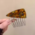 Detailed shot of the blue-brown acetate triangular hair comb, elegant side clip for styling. - Triangular Hair Comb (P111-1#) / Blue Brown