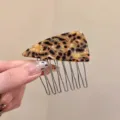 Detailed view of tortoise shell acetate triangle hair comb with metal teeth for side styling. - Triangular Hair Comb (P111-2#) / Yellow Leopard