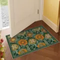 Detailed view of vintage floral doormat with vibrant orange flowers on rich green background. - 40*60cm (Faux Cashmere Plastic Dot Bottom) / Floral 2