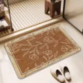 Detailed close-up view of the absorbent bath mat with elegant floral pattern in bathroom setting. - Letter-A