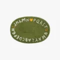 Green oval plush carpet with alphabet pattern, soft non-slip floor mat for bedroom bedside. - Beloved Green C