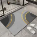 Modern minimalist grey floor mat with gold curve design, highly absorbent non-slip bath mat variant - Loneliness