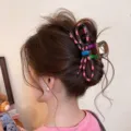 Vista detallada de pinza para el pelo con lazo de lunares esmaltada estilo coreano elegante - Pinza de Lazo Lunar Negro Rosa