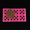 Pink clay mold with grid pattern and four-petal flower stamp for DIY craft and baking. - Four-Petal Flower