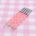 Detail view of double-ended silicone nail art shaping and clay sculpting pens with pink handle. - Rotating Style, Pink