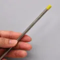 Stainless steel hair texture rod detail, featuring a protective plastic tip for safety. - S