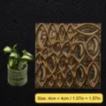 Closeup of miniature brass cutting die with leaf pattern for resin clay and craft embossing. - Miniature Evergreen