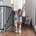 Detailed shot of women's graffiti printed leggings showcasing colorful abstract pattern design. - One Size / Bottoms / Pattern (8802)