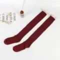 Burgundy cable-knit over-the-knee socks with delicate lace trim for women, winter daily wear. - Burgundy