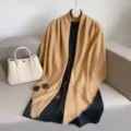Detail view of a versatile solid color khaki large square scarf shawl, soft texture for styling. - Khaki