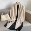 Detailed view of a solid beige large square scarf and shawl, elegant and versatile. - Off White