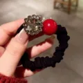 Black hair scrunchie with sparkling rhinestone flower and red pearl bead for stylish ponytails. - B27-2# Oval Pearl Hair Tie