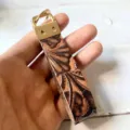 Genuine leather keychain with western vintage embossed floral pattern, detailed close-up shot. - Style 4