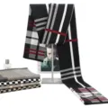Detailed winter plaid scarf in black white red, showing soft fabric and fringe view. - W10-111