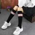 Women black knee high socks Japanese style street fashion cotton long socks model variant. - One Size / Letter Black