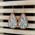 Detailed shot of Western vintage Aztec wooden teardrop earrings with bull skull pattern. - Ethnic Bull Skull Style (3)