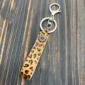 Leopard print cowhide leather keychain detail shot, vintage metal flower charm and ring. - Sun Flower Style (2)