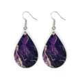 Detailed view of lightweight bohemian wooden teardrop earrings with purple marble print. - Purple Marble Texture (5)
