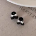 Kleine schwarze Haarklammer mit Strass Schleife für elegante halboffene Frisuren und tägliches Styling. - Weiß