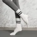 Professional yoga five-toe socks with anti-slip grips and stylish striped mid-calf design. - White