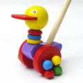 Hölzernes Cartoon-Enten-Schiebespielzeug für Kleinkinder, bunte Lauflernhilfe mit Griff. - Breitschnabelente