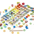Wooden 7-in-1 educational toy set with numbers, letters, shapes, dinosaurs and fishing game. - CSDW053 Multifunctional Counting Board