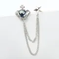 Close-up detail of silver crown heart crystal brooch with double chains and star pendant. - Silver Crown (TL0020)