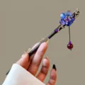 Detail view of Chinese vintage wooden hairpin with blue floral resin charm and dangling bead. - Songhuamandi Style (FZ25121)