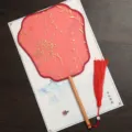 Traditional Chinese round fan with red gauze, gold botanical patterns and wooden handle. - Feixian Beech Wood - Red Catkins