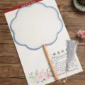 Traditional Chinese silk round fan with wooden handle and tassel, blank white surface. - Beechwood Eight-Petal Pattern - Blue Border