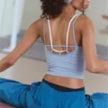 Detailed view of the back strap design of a breathable women sports yoga vest top. - Gray