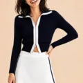 Ensemble de sport pour femme avec cardigan zippé contrasté et jupe de tennis. - S / Hauts / Noir