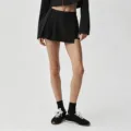 Ensemble jupe-culotte plissée et top court noir, tenue de fitness et de loisirs élégante. - S / Bas / Noir