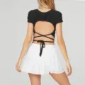 Women black crop top with white pleated tennis skirt, open back activewear fitness set. - QS11-Black