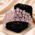 Detailed close-up of a sparkling pink rhinestone tiara crown for wedding bridal hair accessories. - Silver with Pink Rhinestone