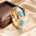 Retro zinc alloy open hinged bangle featuring elegant blue and white enamel wave design details. - Sky Blue and White