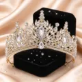 Detailed view of luxury gold bridal rhinestone crown, sparkling crystal leaf tiara close-up. - KC Gold + White Rhinestone