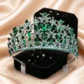 Detail view of exquisite silver bridal tiara with sparkling green rhinestones and hair combs. - Silver with Green Rhinestone